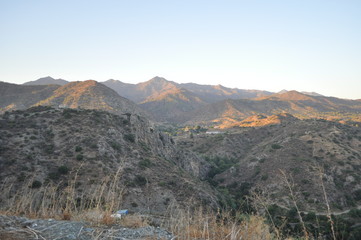 The beautiful natural mountain landscape in the Cyprus massif in the background at sunset