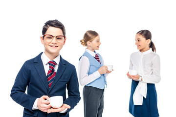 smiling schoolchildren pretending to be businesspeople with coffee cups Isolated On White