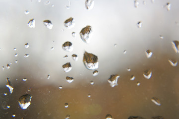 Macro close up of rain drops on the window glass
