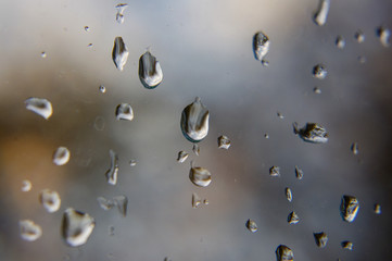 Macro close up of rain drops on the window glass