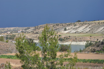 Obraz premium The beautiful natural mountain landscape in the Cyprus massif in the background at sunset