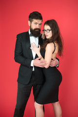 Elegance is not about being noticed. Bearded man wear suit girl elegant dress. Formal dress code. Visiting event or ceremony. Couple ready for award ceremony. Corporate party. Award ceremony concept