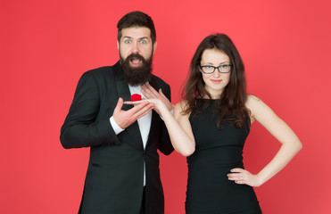 engagement surprise. woman make bearded man marriage proposal. formal couple. ring in box. tuxedo man and elegant lady at engagement party. love date and romance. valentines day. sexy couple in love