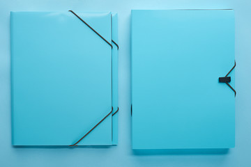 top view of paper binders isolated on blue