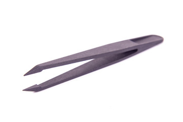 Carbon fiber tweezers isolated on the white background
