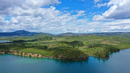 Fototapeta na wymiar Aerial drone panoramic view of famous dam and lake of Marathon with beautiful clouds, North Attica, Greece