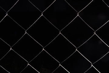 wire fence. seamless chain link fence. industrial fence. low key photo