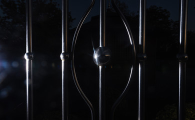 Chrome fence gate. Stainless steel fence. low key photo
