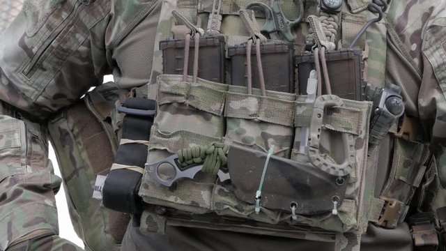 Close-up of the front of a soldier's camouflaged uniform