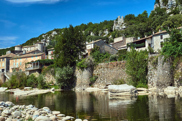 Fototapeta na wymiar The medieval town of Vogue over the River Ardeche in France..