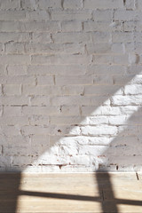 photo background white brick wall and wooden floor light from the window