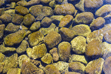 Beautiful textured background of stones under water