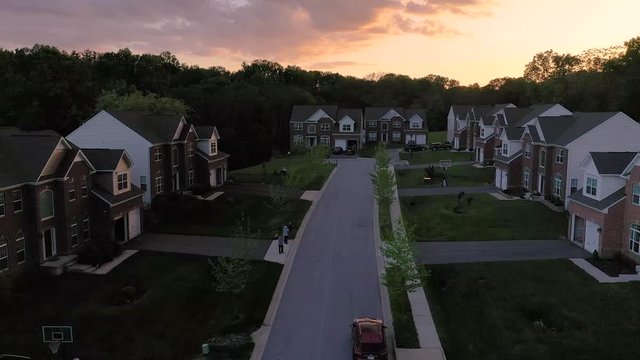 Aerial panorama of upper middle class single family houses real estate in a new construction in Maryland during sunset
