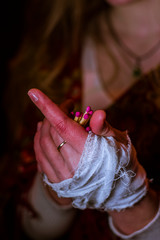 woman praying with rosary in hands