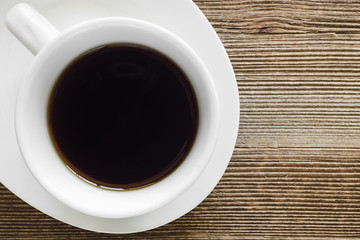 White Cup of Coffee on Rustic Background