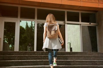 Student with backpack in outdoors