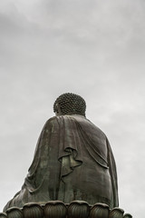 Hong Kong, China - March 7, 2019: Lantau Island. Tian Tan Buddha shows his back, statue from down...