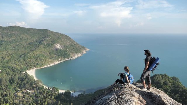 Man and woman Walking on the top of Cliff and enjoying view of nature,Handled shot,No Color Grading 