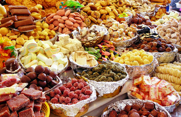 Traditional sweets: cookies, jelly, candy, chocolate, marshmallow, nuts and more at open market during catholic Corpus Christi celebration in Ecuador in Cuenca