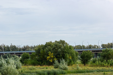 Obraz premium Road bridge passing through the field