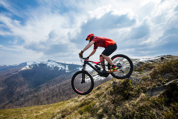 A man is riding  E-bike.