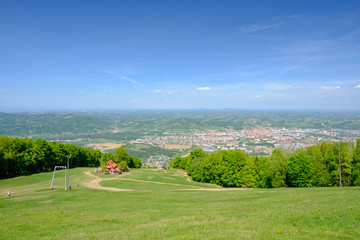 Mariborsko Pohorje, panoramic view of Maribor, Slovenia from Pohorje, mountain hut luka in front