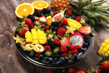 salad with fresh fruits and berries. healthy spring fruit salad  with strawberries