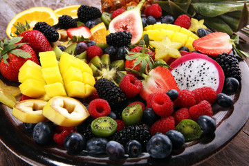 salad with fresh fruits and berries. healthy spring fruit salad  with strawberries