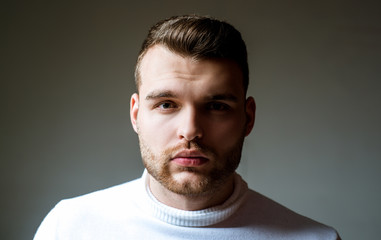 Obraz premium Hairstyle barber. Man bearded macho close up face. Barbershop concept. Beard grooming. Hipster style beard. Handsome bearded guy. Masculinity and beauty. Well groomed bearded man stylish appearance
