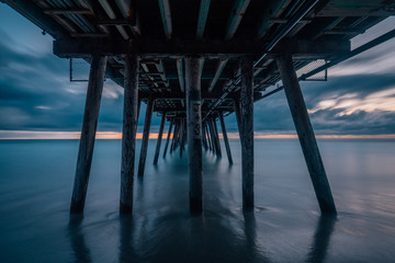 Long exposure after sunset under the pier in Imperial Beach, near San Diego, California