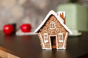 Obraz na płótnie Canvas Christmas gingerbread house. Christmas decorated kithen in loft style. Black, green and red colors. Modern loft style of interior decorated for New Year Eve