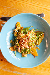 Vegan salad with spinach and peaches for a healthy outdoor dinner