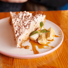 Traditional banoffee pie with whipped cream and caramel sauce