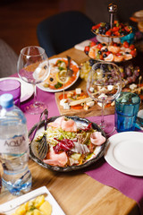 Fototapeta premium Various of starters for a restaurant banquette set on a wooden table