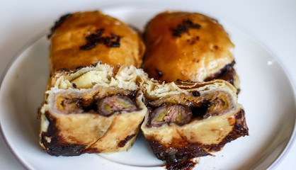 Banana chocolate pastry or bolen on white background. 