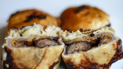 Banana chocolate pastry or bolen on white background. 