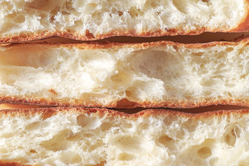 Close up inside french baguette. Horizontal cutting of baguette.