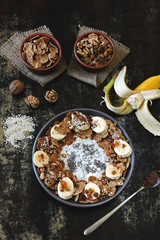 Smoothie bowl with banana, seeds and cereal. Healthy breakfast or dessert.