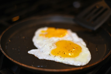 Eggs in pan with pepper