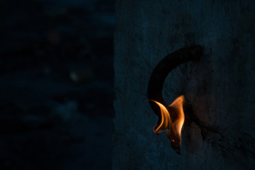 Short circuit, burnt cable, on color wooden background