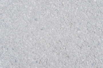 The texture of light asphalt. Stone gray background. Horizontal photo