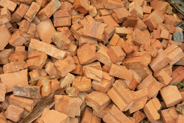 pile of bricks which is prepared for construction. red brick wall at the construction site.