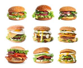 Set of delicious burgers on white background