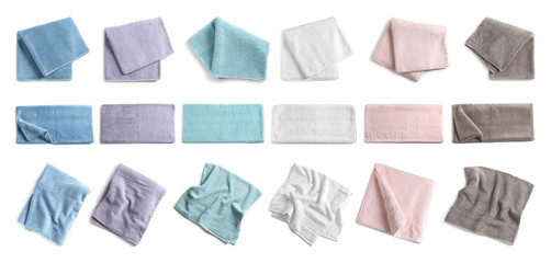Set of different soft terry towels on white background, top view
