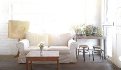 White sofa seat near windows .It decoration in living room 