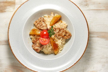 Grilled chicken with white rice. Light wooden background. Restaurant menu