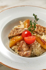 Grilled chicken with white rice. Light wooden background. Restaurant menu