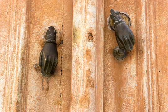 Brown Door with two hands , Tunisia.