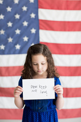 Little girl with American flag background