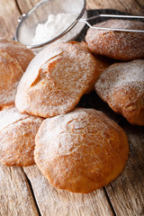 Bunuelos (Mexican fritters) golden, crispy-sweet, tortilla-like fritters are sprinkled with sugar close-up. vertical